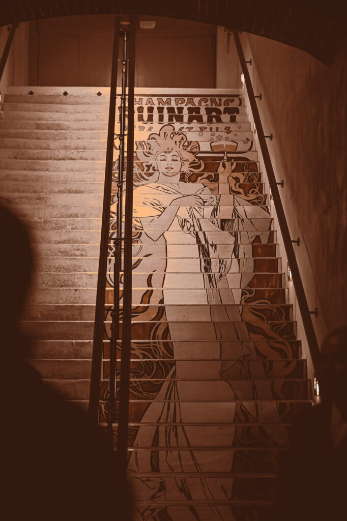 Stairs to the natural chalk cellars at maison ruinart. 