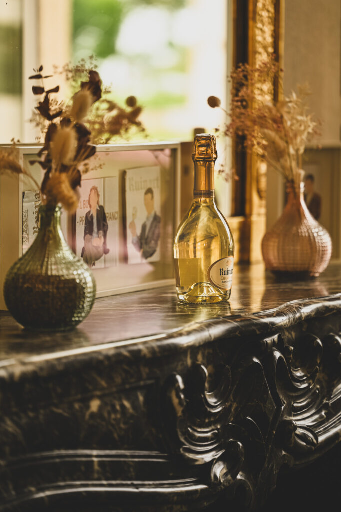 Fireplace with blanc de blanc champagne at maison ruinart, reims france