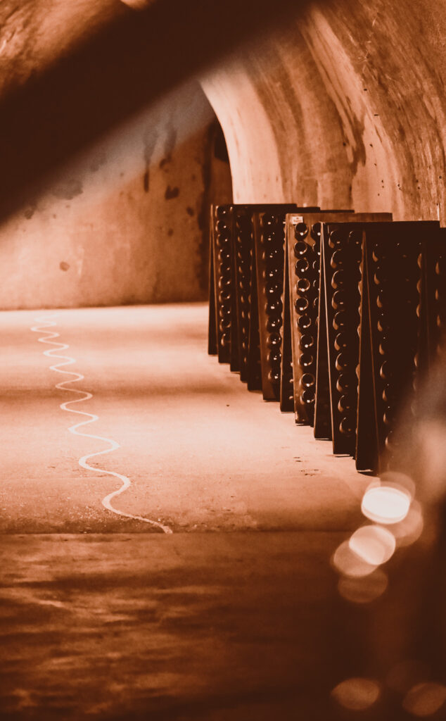 Ruinart Reims Cellar with champagne bottels