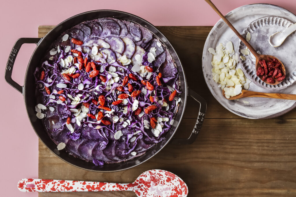 Blue potato gratin with cabbage bechamel and goji berries