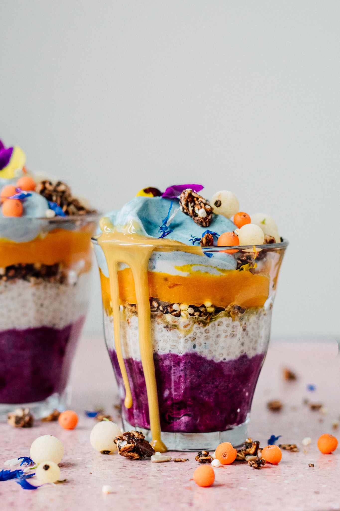 Berry Chia pudding with Mango cream and spirulina yogurt