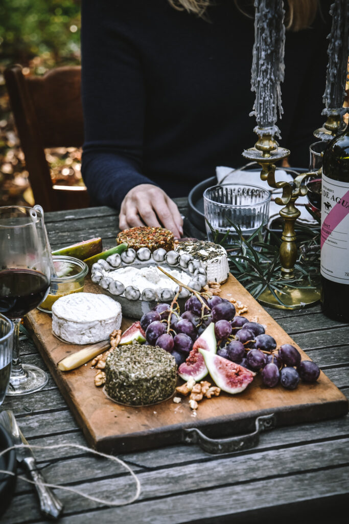 Vegan cheese board with grapees and figs