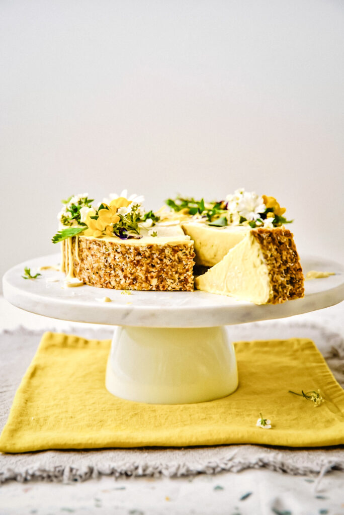 Raw lemon cake on cake stand