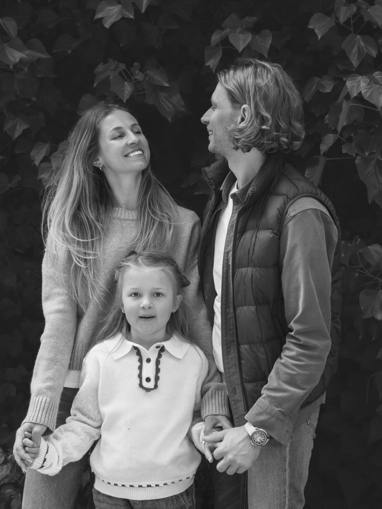 Anna, Sky & Dario in front of an ivy walll